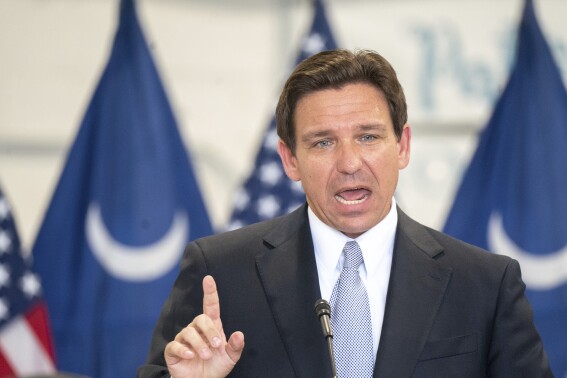 Florida Governor and Republican presidential candidate Ron DeSantis speaks during a press conference at the Celebrate Freedom Foundation Hangar in West Columbia, S.C. July 18, 2023. For DeSantis, Tuesday was supposed to mark a major moment to help reset his stagnant Republican presidential campaign. But yet again, the moment was overshadowed by Donald Trump. The former president was the overwhelming focus for much of the day as DeSantis spoke out at a press conference and sat for a highly anticipated interview designed to reassure anxious donors and primary voters that he's still well-positioned to defeat Trump.(AP Photo/Sean Rayford)