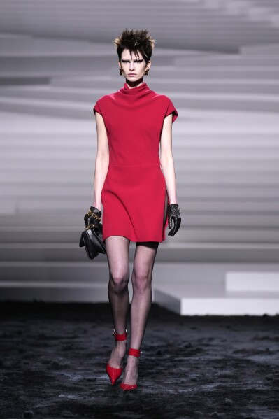 A model wears a creation as part of the Versace women's Fall-Winter 2024-25 collection presented in Milan, Italy, Friday, Feb. 23, 2024. (AP Photo/Antonio Calanni)