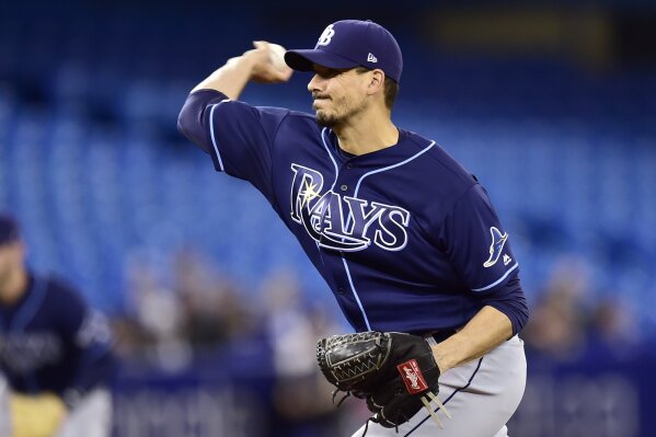 
              Tampa Bay Rays starting pitcher Charlie Morton (50) delivers a pitch to home plate during first inning baseball action against the Toronto Blue Jays in Toronto on Sunday, April 14, 2019. (Frank Gunn/The Canadian Press via AP)
            