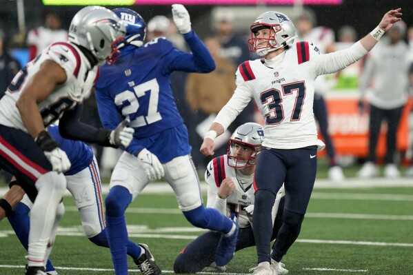 New England Patriots place kicker Chad Ryland (37) watches as his field goal attempt sails wide left with seconds left on the clock during the fourth quarterof an NFL football game against the New York Giants, Sunday, Nov. 26, 2023, in East Rutherford, N.J. (AP Photo/Seth Wenig)