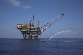 FILE - In this Sept. 2, 2015 file photo, a rig is seen in the Tamar natural gas field in the Mediterranean Sea, off the coast of Israel. Delek Drilling, one of Israel's biggest energy companies plans to sell its share of a large offshore gas field to a firm based in the United Arab Emirates for an estimated $1.1 billion, the biggest such deal since the two countries normalized ties last year. Delek is required to sell its 22% share of the offshore Tamar gas field by the end of this year as part of a 2015 gas framework agreement aimed at introducing more competition to the Israeli gas sector. (AP Photo/Marc Israel Sellem, File)