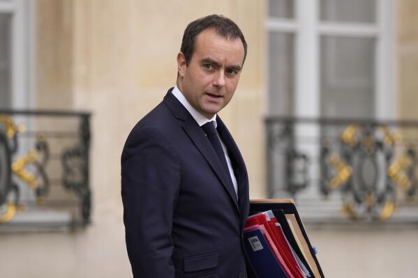French Defense Minister Sebastien Lecornu walks out the Elysee Palace after the last weekly cabinet meeting of the year, in Paris, Thursday, Dec. 22, 2022. (AP Photo/Francois Mori)
