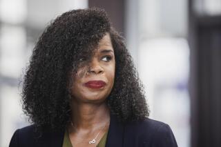 FILE - Cook County State's Attorney Kim Foxx reacts during a news conference at the George N. Leighton Criminal Courthouse, Feb. 1, 2022 in Chicago. On Tuesday, April 25, 2023, Foxx, the Chicago area's top prosecutor, announced that she will not seek re-election after two terms of intense scrutiny of her efforts to overhaul criminal prosecutions and her approach to high-profile cases, including charges against actor Jussie Smollett for staging a racist, homophobic attack against himself. (Pat Nabong/Chicago Sun-Times via AP, File)