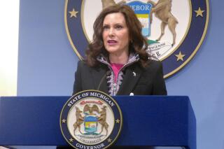 FILE - Mich. Gov. Gretchen Whitmer speaks at a news conference on Friday, March 11, 2022, at the governor's office in Lansing, Mich. Michigan lawmakers voted Tuesday, March 15, 2022 to suspend the state's 27.2-cents-a-gallon gasoline and diesel taxes for six months, finalizing a bill that Gov. Gretchen Whitmer has signaled she will veto. (AP Photo/David Eggert File)