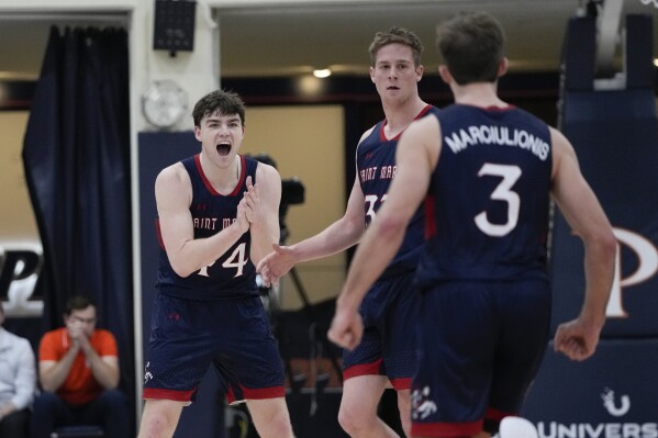 Saint Mary's guards Alex Ducas, Luke Barrett, and Augustas Marciulionis, from left, react during the first half of the team's NCAA college basketball game against Pepperdine on Thursday, Feb. 29, 2024, in Malibu, Calif. (AP Photo/Ryan Sun)