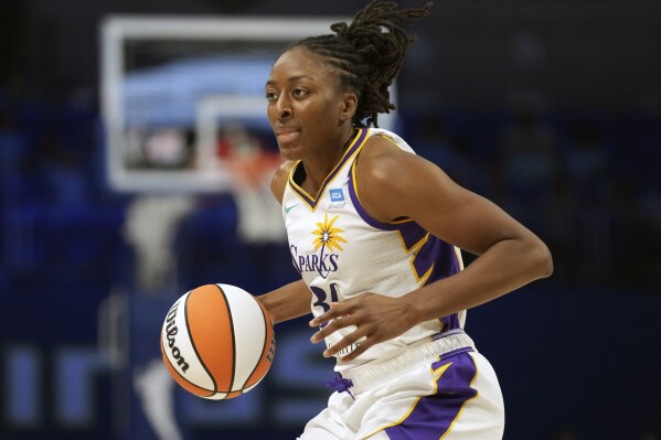 FILE - Los Angeles Sparks forward Nneka Ogwumike dribbles the ball during the second half of the team's WNBA basketball basketball game against the Dallas Wings in Arlington, Texas, June 14, 2023. Ogwumike is going to be wearing a new uniform next season as she has told the Sparks that she's going to leave in free agency. Ogwumike has played her entire 12-year career with the Sparks after being drafted No. 1 by the team in 2012. (APPhoto/LM Otero, File)
