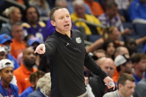 Florida head coach Mike White directs his players during the second half of an NCAA men's college basketball game against Texas A&M at the Southeastern Conference tournament in Tampa, Fla., Thursday, March 10, 2022. (AP Photo/Chris O'Meara)
