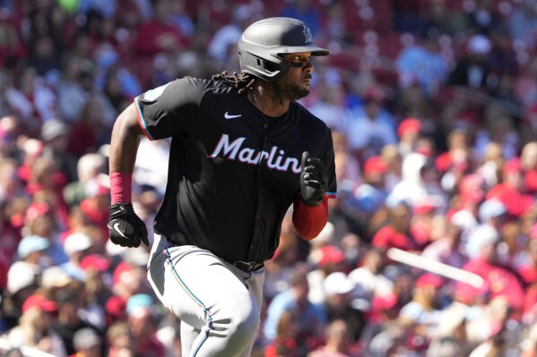 Miami Marlins' Josh Bell heads to first on an RBI single during the eighth inning of a baseball game against the St. Louis Cardinals Saturday, April 6, 2024, in St. Louis. (AP Photo/Jeff Roberson)