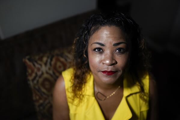 Daphne Bolton poses for a portrait at her home on Monday, May 31, 2021, in Charlotte, N.C. Bolton's brother, Johnny Lorenzo Bolton, a 49-year-old Black man was shot to death by a Cobb County Sheriff's Office SWAT team member serving a search warrant last December. (AP Photo/Chris Carlson)