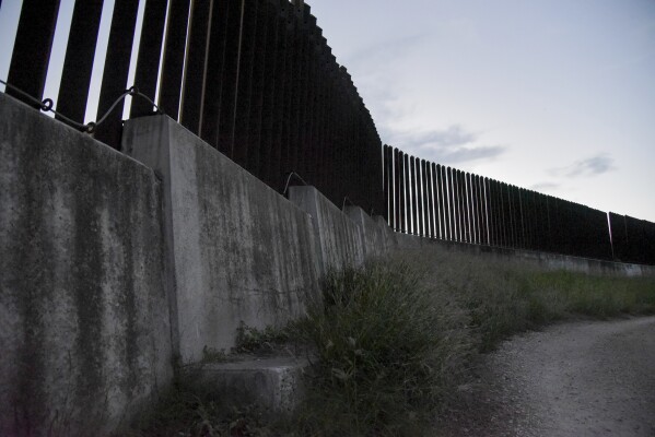 An example of Jersey-style border fencing in Brownsville, Texas, on Tuesday, Nov. 7, 2023. The Biden administration's plan to build new barriers along the U.S.-Mexico border calls for a "movable" design that frustrates both environmentalists and advocates of stronger border enforcement. (AP Photo/Valerie Gonzalez)
