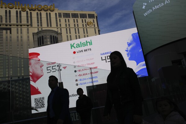 Betting odds on Presidential election results are displayed on screens along The Strip, Tuesday, Nov. 5, 2024, in Las Vegas. (AP Photo/John Locher)