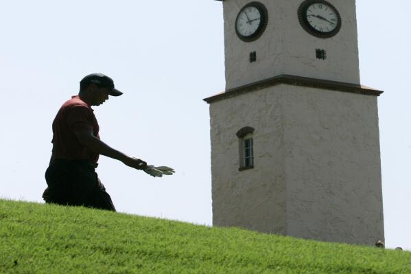 FILE - Tiger Woods walks down the fifth fairway during the final round of the 89th PGA Golf Championship at the Southern Hills Country Club in Tulsa, Okla., Aug. 12, 2007. Woods is expected back as the PGA returns to Southern Hills for the fifth time, May 19-22. (AP Photo/Charles Krupa, File)