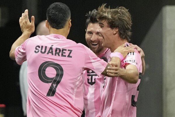 Inter Miami's Lionel Messi, center, celebrates after scoring his side's second goal during the Club World Cup group A soccer match between Inter Miami and FC Porto in Atlanta, Thursday, June 19, 2025. (AP Photo/Brynn Anderson)