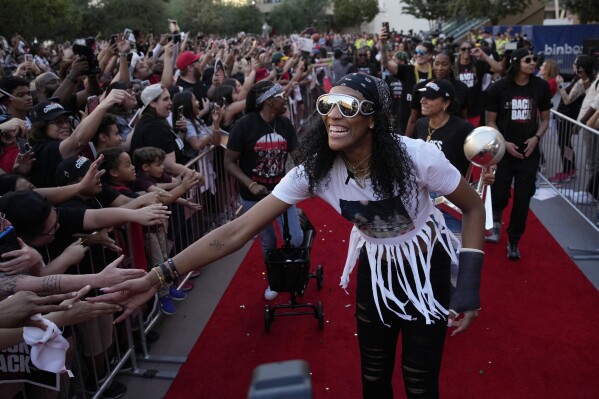 Las Vegas Aces forward A'ja Wilson celebrates during a rally to celebrate the team's WNBA championship Monday, Oct. 23, 2023, in Las Vegas. (AP Photo/John Locher)