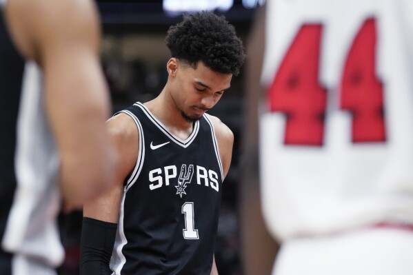 San Antonio Spurs center Victor Wembanyama reacts after a missed a free throw during the second half of an NBA basketball game against the Chicago Bulls in Chicago, Monday, Jan. 6, 2025. (AP Photo/Nam Y. Huh, File)