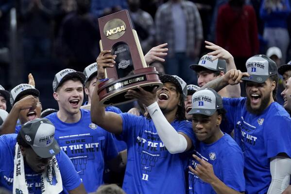 Duke players celebrate after defeating Arkansas in a college basketball game in the Elite 8 round of the NCAA men's tournament in San Francisco, Saturday, March 26, 2022. (AP Photo/Marcio Jose Sanchez)