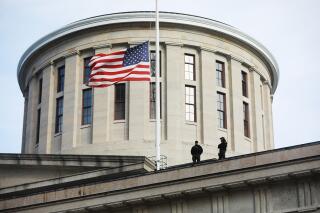 FILE - Troopers are visible on the Ohio Statehouse roof in Columbus, Ohio, on Jan. 13, 2021. A federal investigation is underway after feces were sent to Ohio's 25 Republican state senators. The letters were intercepted by mailroom employees in the Ohio Statehouse and post offices in Cleveland and Akron. Why they were sent is unclear. (Doral Chenoweth/The Columbus Dispatch via AP, File)