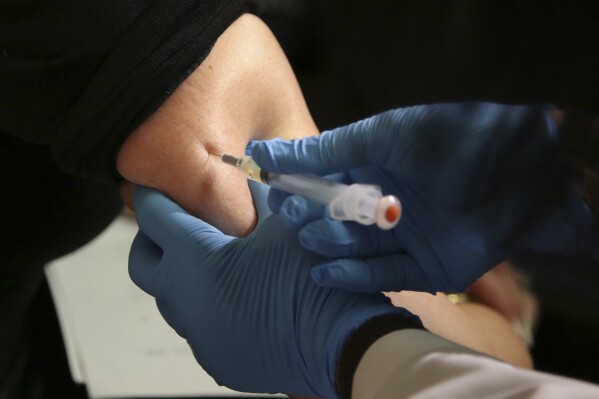 FILE - In this March 27, 2019, file photo, a woman receives a measles, mumps and rubella vaccine at the Rockland County Health Department in Pomona, N.Y. Measles outbreaks in the U.S. and abroad are raising health experts' concern about the preventable, once-common childhood virus. The CDC on Thursday, April 11, 2024 released a report on recent measles case trends, noting that cases in the first three months of this year were 17 times higher than the average number seen in the first three months of the previous three years. (AP Photo/Seth Wenig, File)