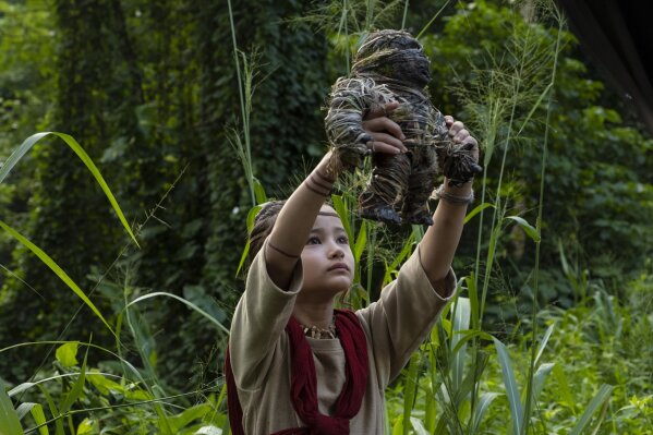 This image released by Warner Bros. Entertainment shows Kaylee Hottle in a scene from "Godzilla vs. Kong." (Warner Bros. Entertainment  via AP)