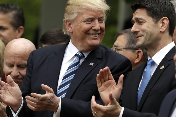 
              In this May 4, 2017, photo, President Donald Trump talks to House Speaker Paul Ryan of Wis. in the Rose Garden of the White House in Washington, after the House pushed through a health care bill. (AP Photo/Evan Vucci)
            