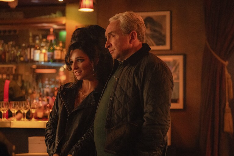This image released by Focus Features shows Marisa Abela as Amy Winehouse, left, and Eddie Marsan as Mitch Winehouse, in a scene from "Back to Black." (Focus Features via AP)