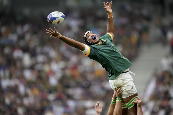 South Africa's Marvin Orie tries to grab the line out ball during the Rugby World Cup Pool B match between South Africa and Romania at the Stade de Bordeaux in Bordeaux, France, Sunday, Sept. 17, 2023. (AP Photo/Christophe Ena)