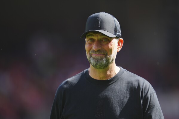 Liverpool's manager Jurgen Klopp smiles ahead the start of the English Premier League soccer match between Liverpool and Wolverhampton Wanderers at Anfield Stadium in Liverpool, England, Sunday, May 19, 2024. (AP Photo/Jon Super)