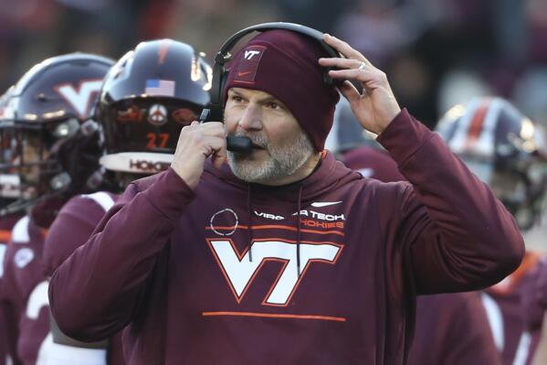 Virginia Tech head coach Justin Fuente is shown during a timeout in an NCAA college football game against Duke on Saturday, Nov. 13, 2021, in Blacksburg, Va. Virginia Tech and football coach Justin Fuente have mutually agreed to part ways with two games left in his sixth season with the Hokies. In a statement, athletic director Whit Babcock said co-defensive line coach and recruiting coordinator J,C. Price will lead the Hokies through their final two regular season games.  (Matt Gentry/The Roanoke Times via AP)