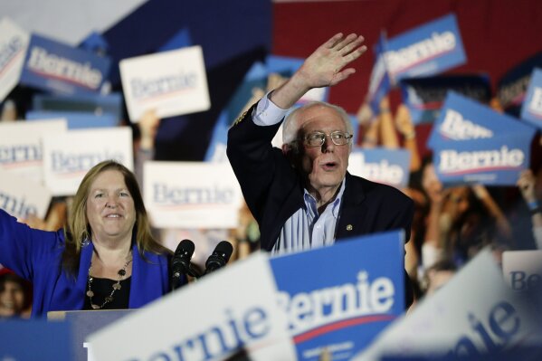Democratic presidential candidate Sen. Bernie Sanders, I-Vt., right, with his wife Jane, speaks during a campaign event in San Antonio, Saturday, Feb. 22, 2020. (AP Photo/Eric Gay)