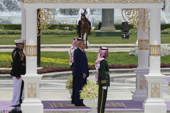 President Donald Trump stands with Saudi Crown Prince Mohammed bin Salman during a welcome ceremony at the Royal Palace in Riyadh, Saudi Arabia, Tuesday, May 13, 2025. (AP Photo/Alex Brandon)