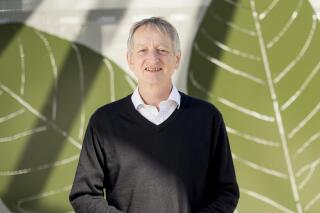 File - Computer scientist Geoffrey Hinton poses at Google's Mountain View, Calif, headquarters on Wednesday, March 25, 2015. Computer scientists who helped build the foundations of today's artificial intelligence technology are warning of its dangers, but that doesn't mean they agree on the risks or how to prevent disastrous outcomes. (AP Photo/Noah Berger, File)