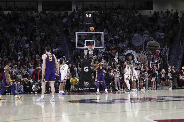 LSU guard Jordan Wright (6) makes two free throws for a one point lead during the second half of an NCAA college basketball game against South Carolina Saturday, Feb. 17, 2024, in Columbia, S.C. LSU won 64-63. (APPhoto/Artie Walker Jr.)