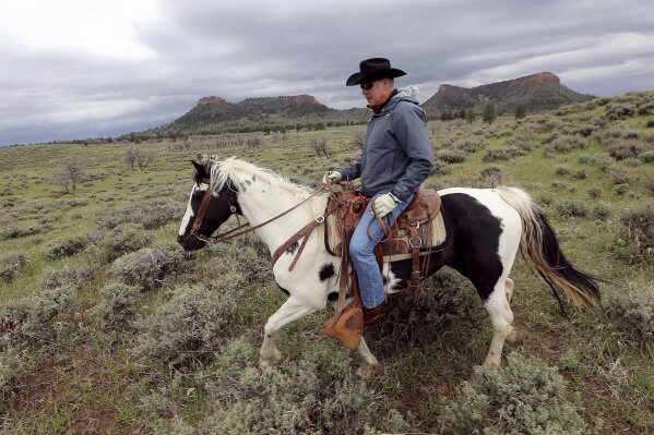 
              FILE - In this May 9, 2017, file photo, then Interior Secretary Ryan Zinke rides a horse in the new Bears Ears National Monument near Blanding, Utah. As former U.S. Interior Secretary Zinke exits Washington amid a cloud of unresolved ethics investigations, he says he has lived up to the conservation ideals of Teddy Roosevelt and insists the myriad allegations against him will be proven untrue. Zinke said he quit President Donald Trump’s cabinet on his own terms, despite indications he was pressured by the White House to resign effective Wednesday, Jan. 2, 2019. (Scott G Winterton/The Deseret News via AP, File)
            