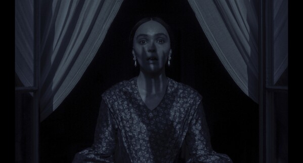 This imaged released by Focus Features shows Lily-Rose Depp in a scene from "Nosferatu". (Focus Features via AP)