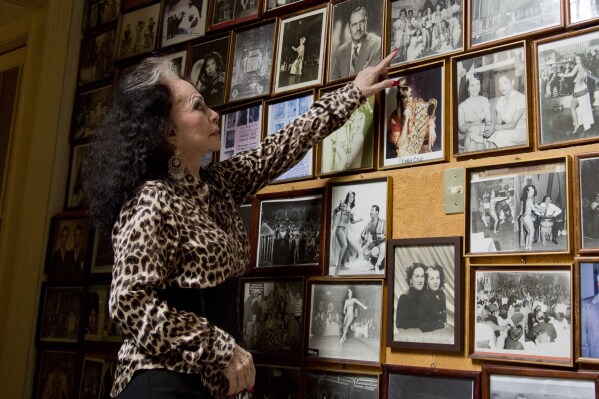 Dancer Yolanda Montez, better known as Tongolele, talks about a photograph in her home, during an interview in Mexico City, March 18, 2014. (AP Photo/Eduardo Verdugo, File)