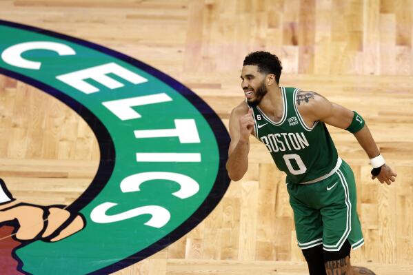 Boston Celtics forward Jayson Tatum heads the other way after missing a shot during the second half in Game 5 of the NBA basketball Eastern Conference finals against the Miami Heat Thursday, May 25, 2023, in Boston. (AP Photo/Michael Dwyer)