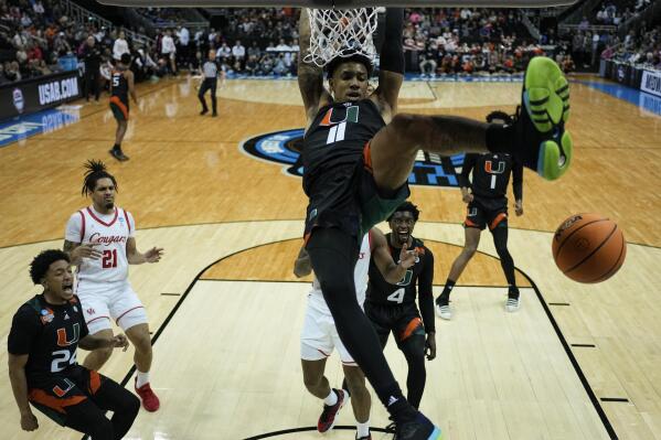 Miami guard Jordan Miller scores against Houston in the second half of a Sweet 16 college basketball game in the Midwest Regional of the NCAA Tournament Friday, March 24, 2023, in Kansas City, Mo. (AP Photo/Jeff Roberson)