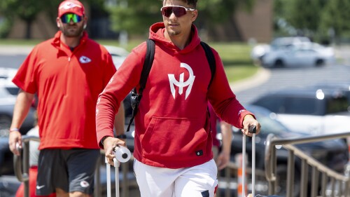 Kansas City Chiefs quarterback Patrick Mahomes wheels his belongings into a dorm room at Missouri Western State University during the first day of NFL football training camp on Tuesday, July 18, 2023, in St. Joseph, Mo. (Nick Wagner/The Kansas City Star via AP)