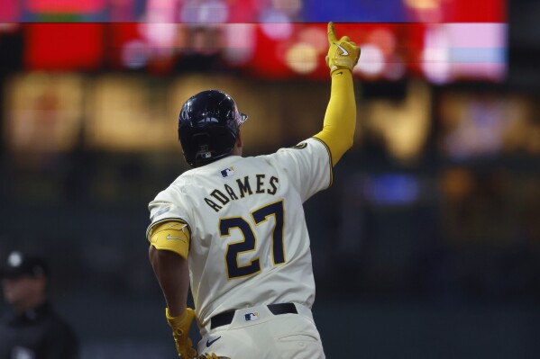 Milwaukee Brewers' Willy Adames reacts after his home run during the fourth inning of a baseball game against the Seattle Mariners Sunday, April 7, 2024, in Milwaukee. (AP Photo/Jeffrey Phelps)