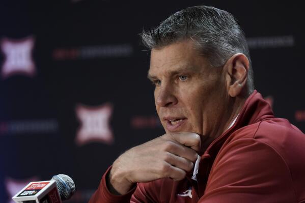 Oklahoma coach Porter Moser speaks to the media during Big 12 NCAA college basketball media day Wednesday, Oct. 20, 2021, in Kansas City, Mo. (AP Photo/Charlie Riedel)