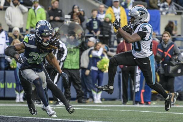 Panthers run over and through Seahawks for 30-24 victory