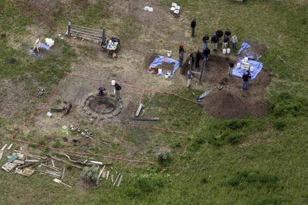 FILE - In this aerial photo, investigators search for human remains at Chad Daybell's residence in Salem, Idaho, on June 9, 2020. A mother charged with murder in the deaths of her two children is set to stand trial in Idaho. The proceedings against Lori Vallow Daybell, the wife of Chad Daybell, beginning Monday, April 3, 2023, could reveal new details in the strange, doomsday-focused case. (John Roark/The Idaho Post-Register via AP, File)