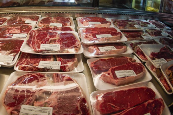 FILE - Rows of fresh cut beef are displayed in the coolers of the retail section at the Wight's Meat Packing facility, June 16, 2022, in Fombell, Pa. The U.S. Department of Agriculture on Monday, March 11, 2024, announced new requirements for meat and egg producers who use the voluntary “Product of USA” or “Made in the USA” labels on their products. (AP Photo/Keith Srakocic, File)