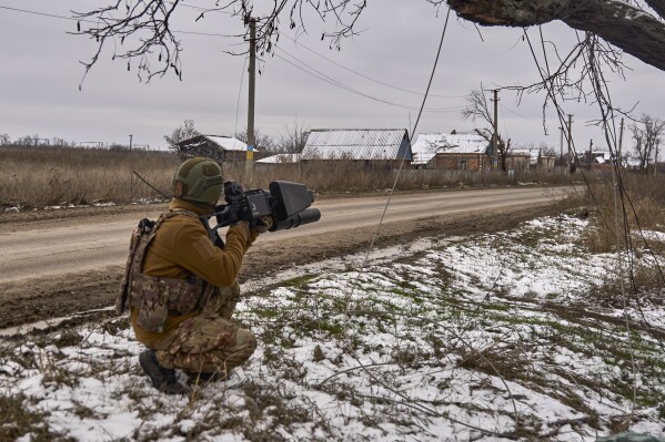 This photo provided by the Ukrainian 10th Mountain Assault Brigade "edelweiss"A Ukrainian soldier places an anti-drone gun at his position near Bakhmut, Donetsk region, Ukraine, Thursday, Nov. 23, 2023.  (Shandiba Mykyta, Ukrainian 10th Mountain Assault Brigade "edelweiss" via ap, file)