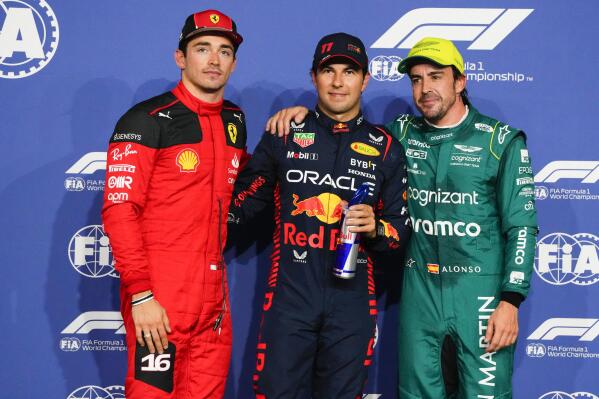 From left: Ferrari driver Charles Leclerc of Monaco, Red Bull driver Sergio Perez of Mexico and Aston Martin driver Fernando Alonso of Spain pose for a photo after the qualifying session ahead of the Formula One Grand Prix at the Jeddah corniche circuit in Jeddah, Saudi Arabia, Saturday, March 18, 2023. Sergio Perez stepped up for Red Bull to ensure the team started from the pole at the Saudi Arabian Grand Prix after a mechanical issue sidelined two-time defending world champion Max Verstappen. (AP Photo/Hassan Ammar)