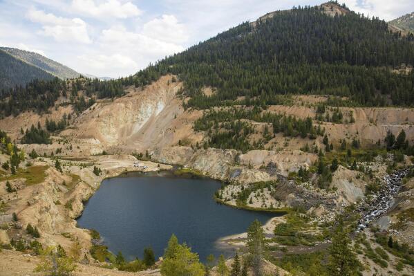 FILE - The Yellow Pine Pit open-pit gold mine in the Stibnite Mining District in central Idaho, where a company hopes to start mining again, Sept. 19, 2018. The U.S. Forest Service on Friday, Oct. 28, 2022, made public an environmental study for British Columbia-based Perpetua Resources' Stibnite Gold Project about 40 miles east of McCall. (Riley Bunch/The Idaho Press-Tribune via AP, File)