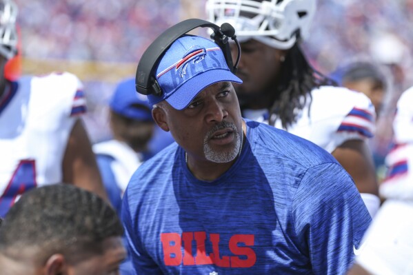 FILE - Buffalo Bills assistant head coach/defensive line Eric Washington talks with his players during an NFL pre-season football game against the Indianapolis Colts, Aug. 12, 2023, in Orchard Park, N.Y. Washington is returning to Chicago as the new defensive coordinator for the Bears after he began his NFL coaching career with the franchise. (AP Photo/Gary McCullough, File)