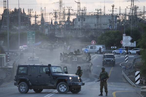Israeli tanks move near the Israeli Gaza border, Israel, Wednesday, Oct. 11, 2023. (AP Photo/Erik Marmor)