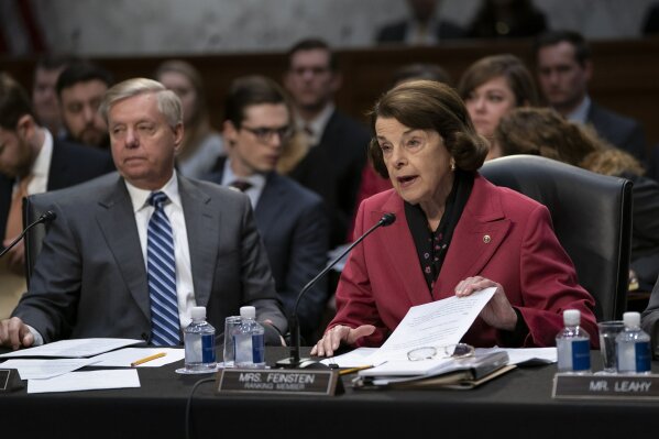 
              Senate Judiciary Committee Chairman Lindsey Graham, R-S.C., listens at left as Sen. Dianne Feinstein, D-Calif., the ranking member, objects to advancing the nomination of Bill Barr to be attorney general, on Capitol Hill in Washington, Thursday, Feb. 7, 2019. (AP Photo/J. Scott Applewhite)
            