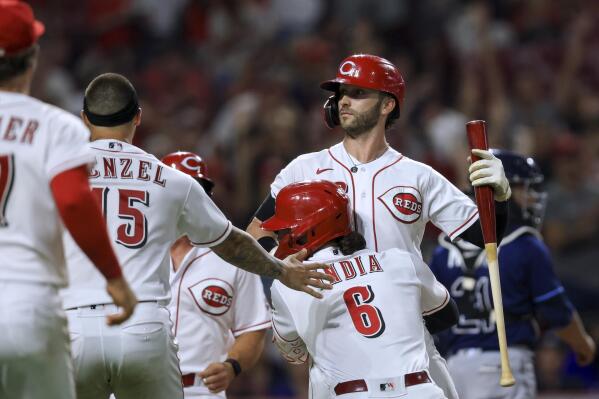 Miley goes 7, Naquin extends streak, Reds beat Marlins 6-0